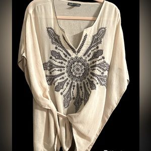 Cream blouse with gray embroidery on front and trim
